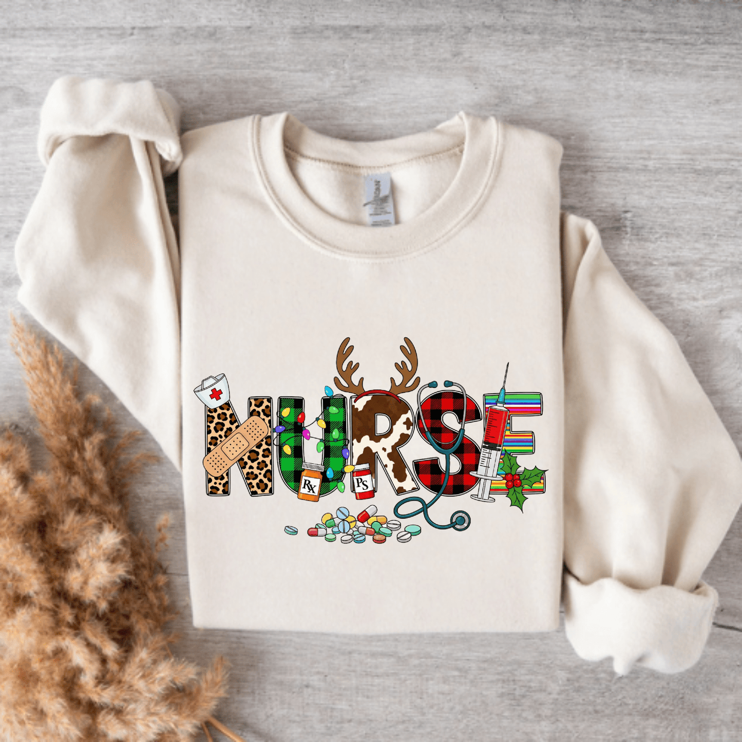 Christmas Nurse Crewneck – Festive Holiday Sweatshirt with Reindeer Antlers & Santa Hat | Cute Nurse Christmas Gift for RN, LPN, CNA & Healthcare Workers Sand