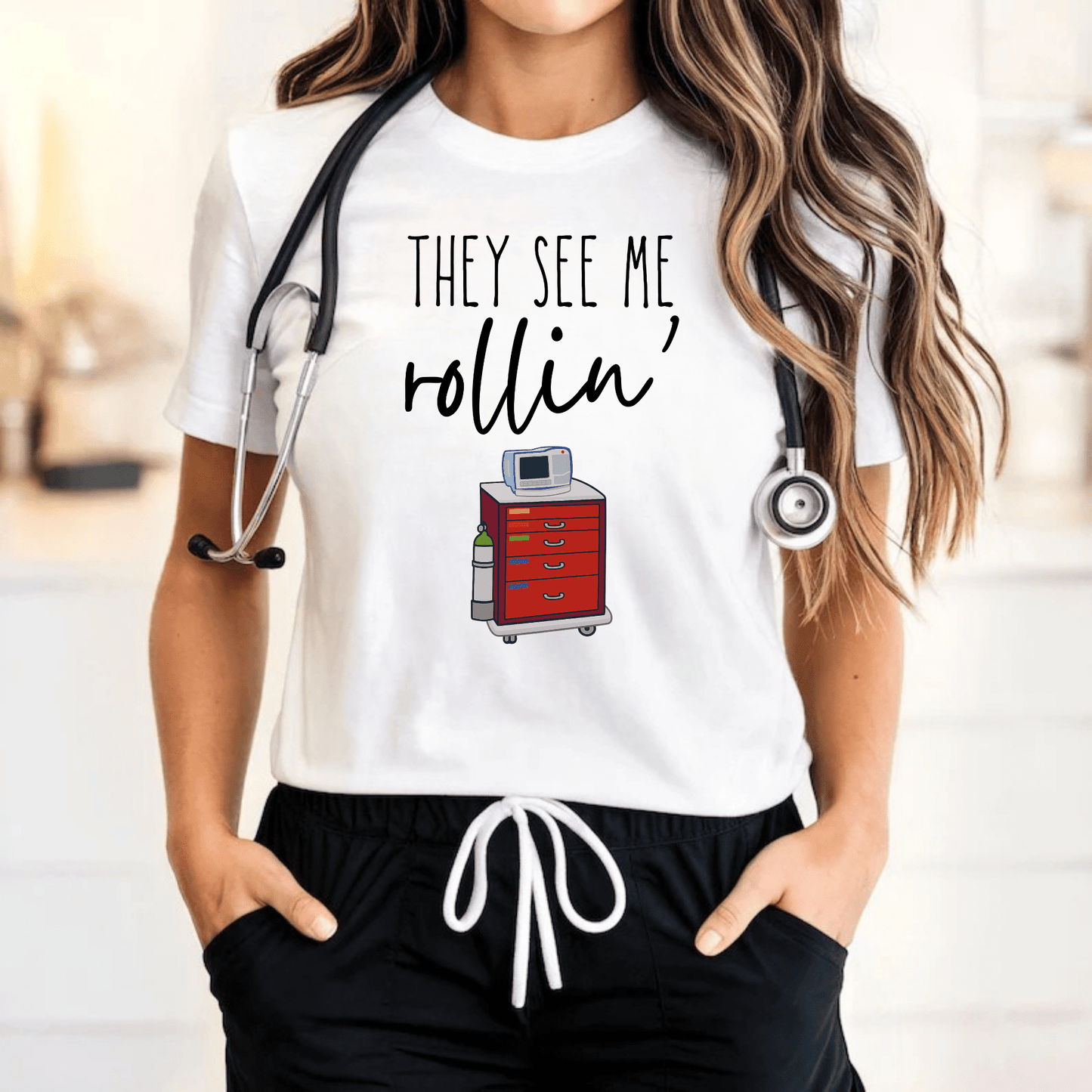 Funny Nurse T-Shirt – "They See Me Rollin’" Crash Cart Design | Medical Scrub Life Tee for Healthcare Workers, RNs, & EMTs White